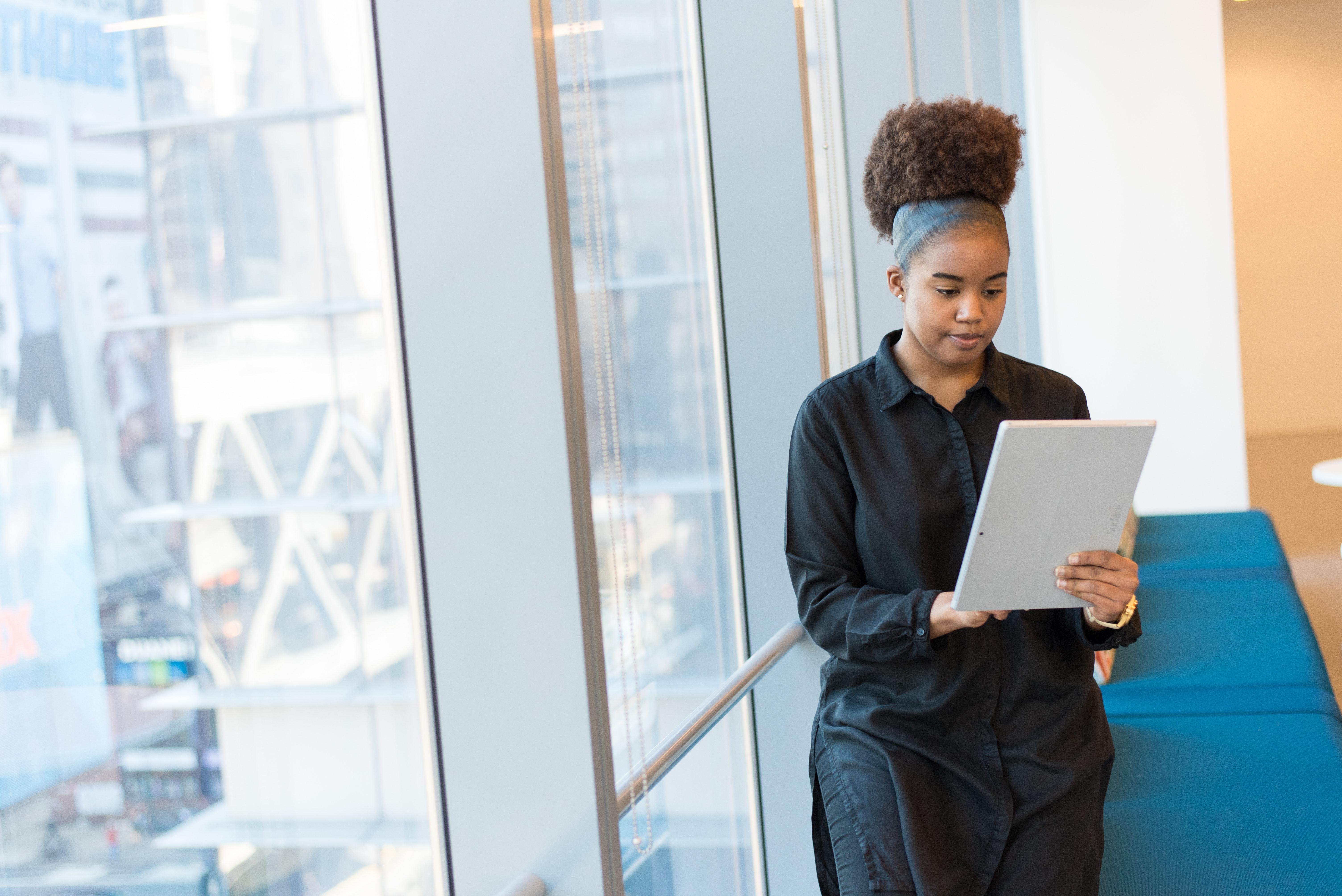 Female Applicant reviewing job board postings