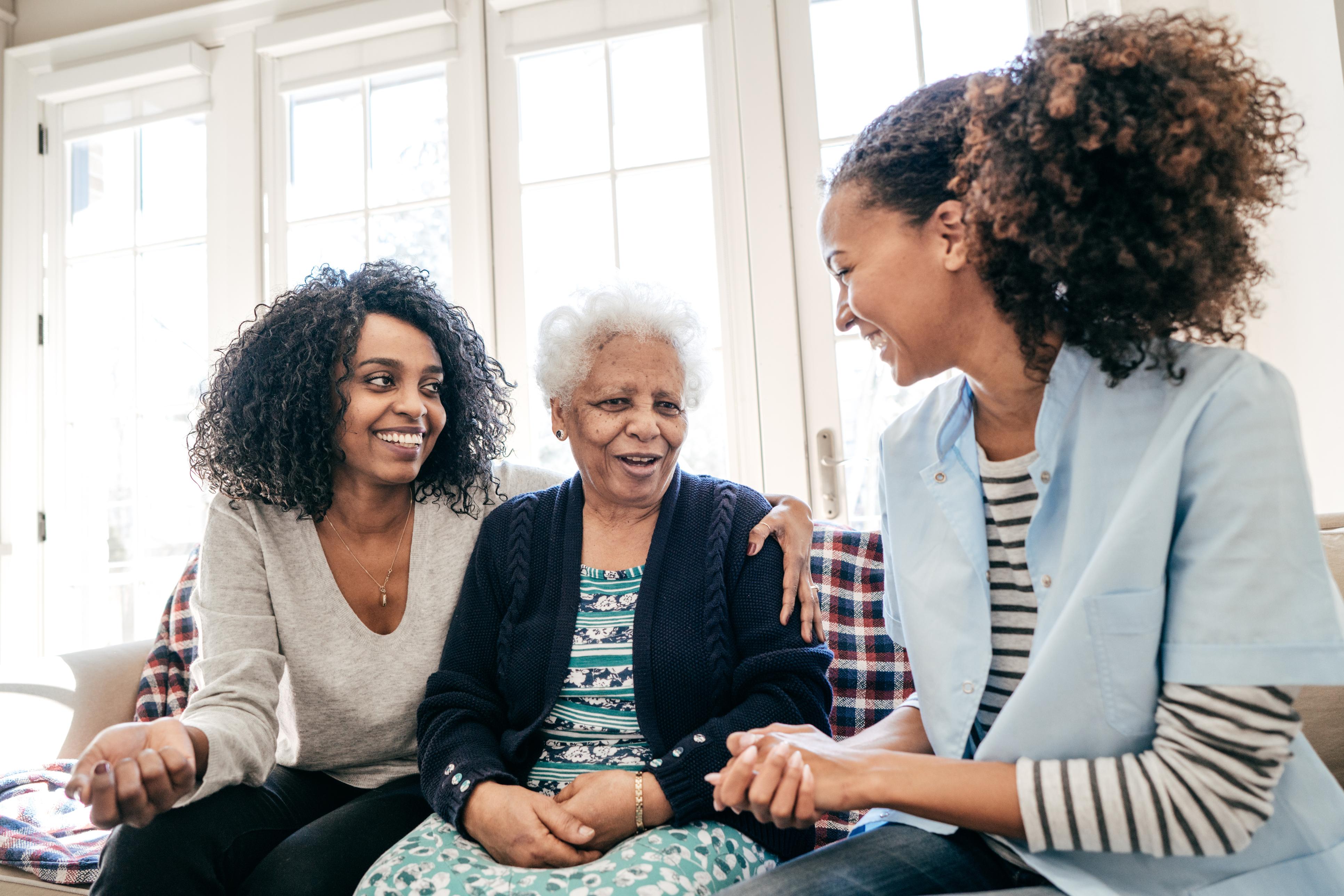 Woman with elderly mother and her careworker